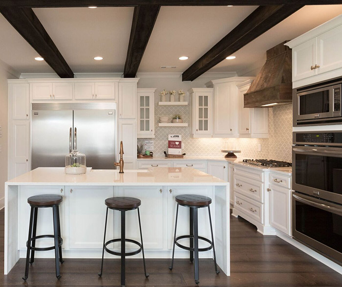 White kitchen cabinets in the Lautner door style